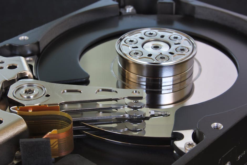 Detailed shot of an open hard disk drive showing its internal components.