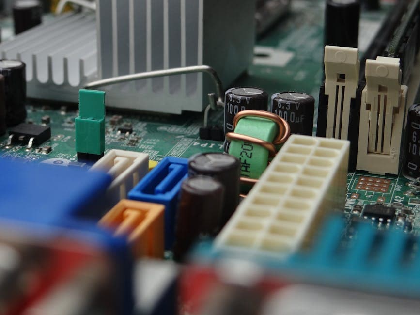 Detailed view of electronic components on a computer motherboard focusing on connectors and capacitors.